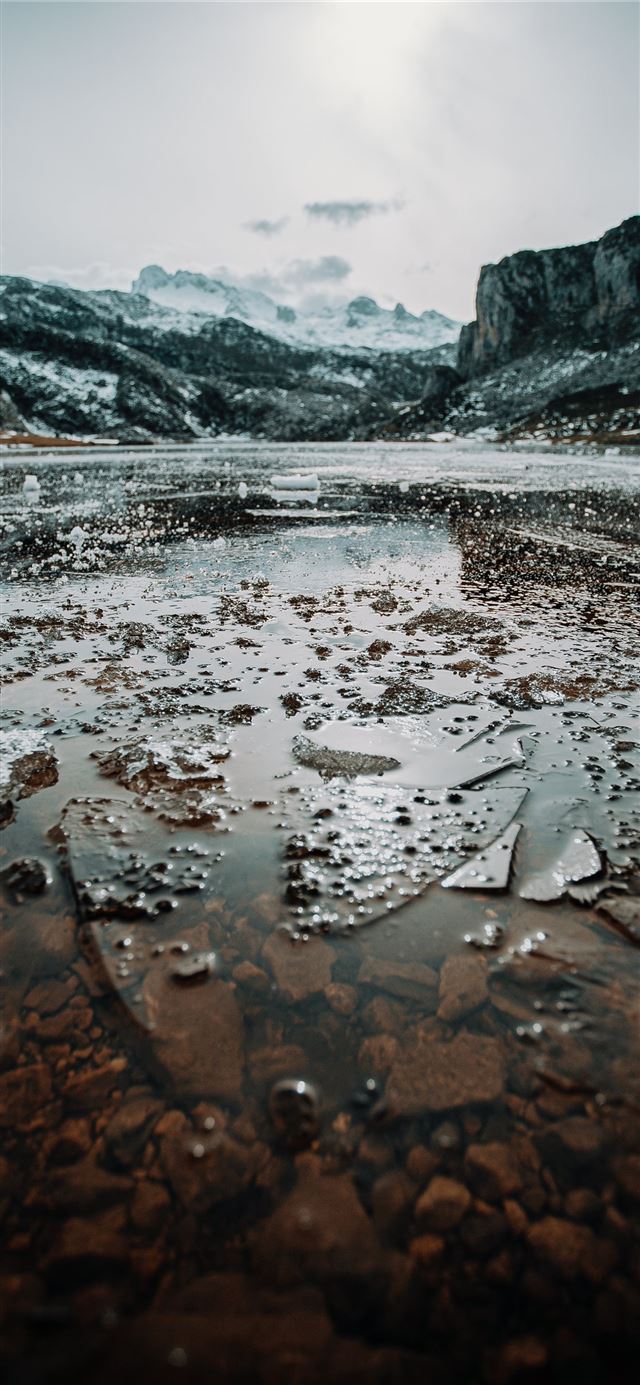 1125x2436 body of water near mountain during daytime - grey iPhone 11 Wallpaper