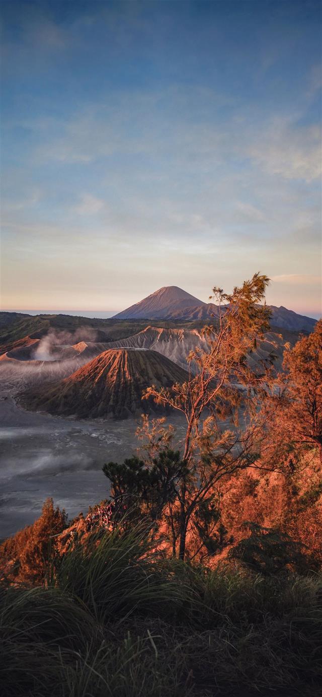 1125x2436 gray mountain near trees under blue sky - indonesia iPhone 11 Wallpaper