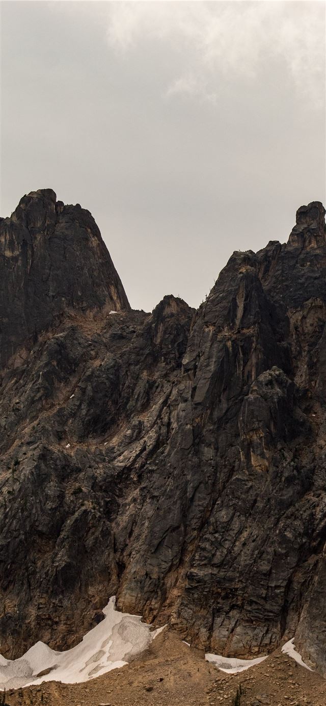 1125x2436 gray rock hill under blue sky - mountain iPhone 11 Wallpaper