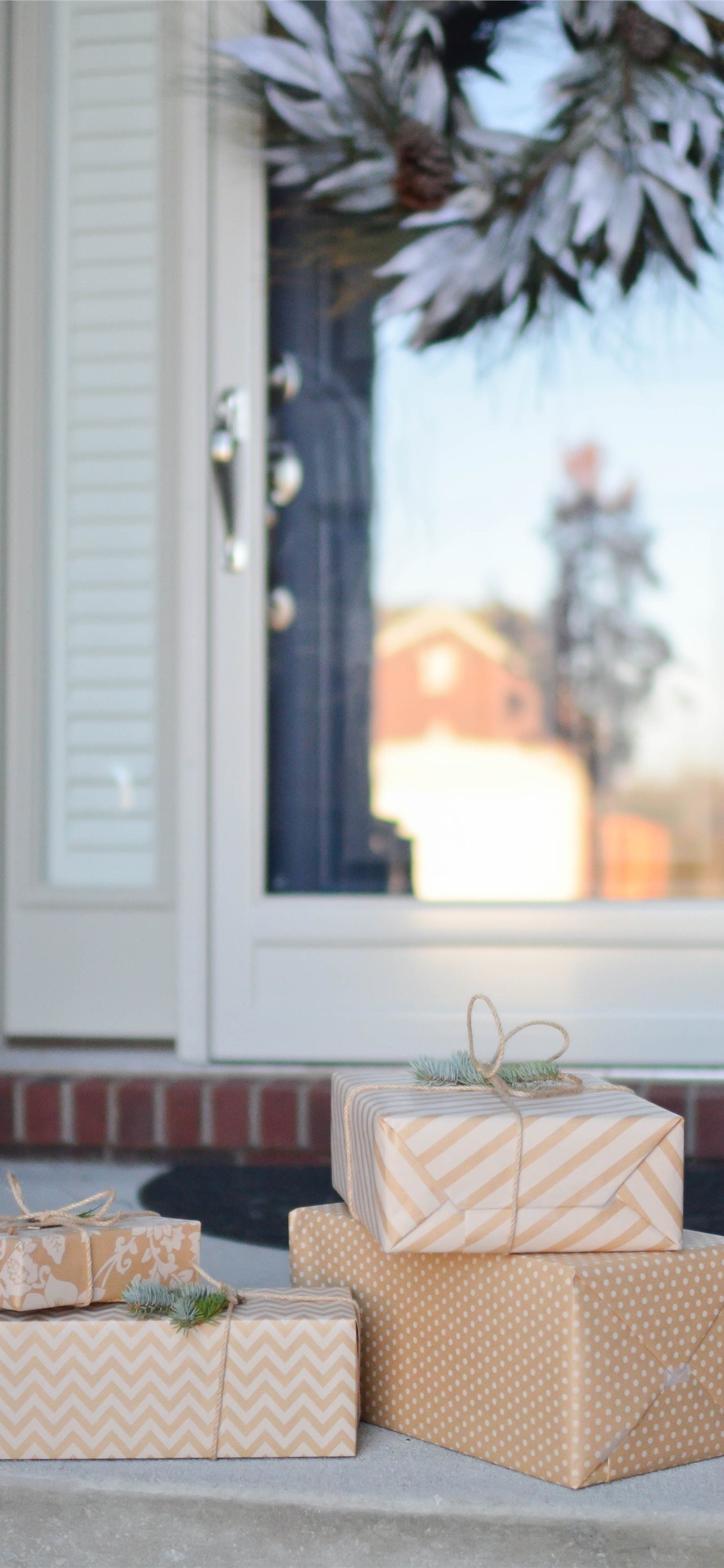 four brown gift boxes near white door iPhone wallpaper 