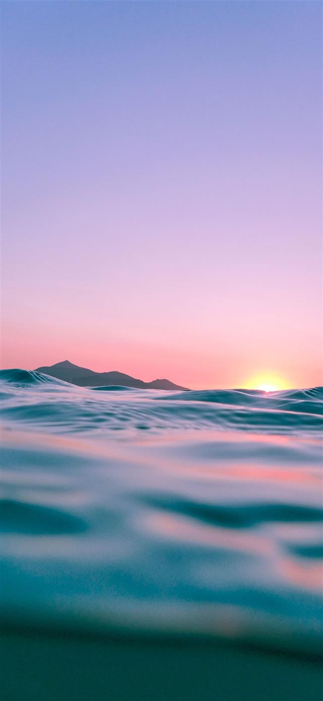 calm body of water during golden hour iPhone 12 wallpaper 