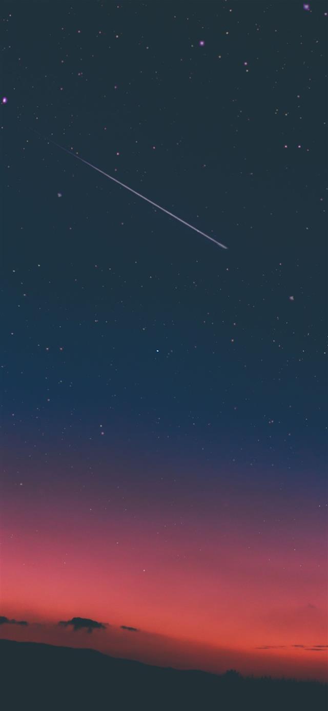 shooting star in night sky iPhone 12 wallpaper 