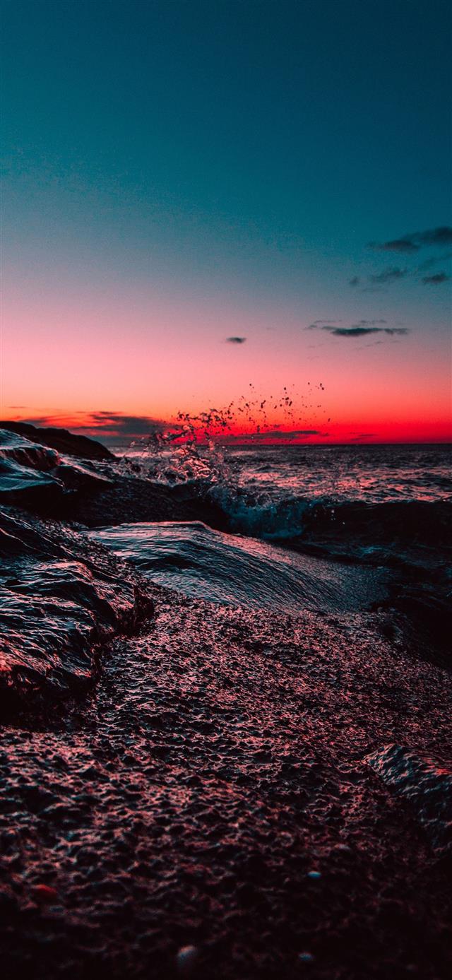 body of water during sunset iPhone 12 wallpaper 