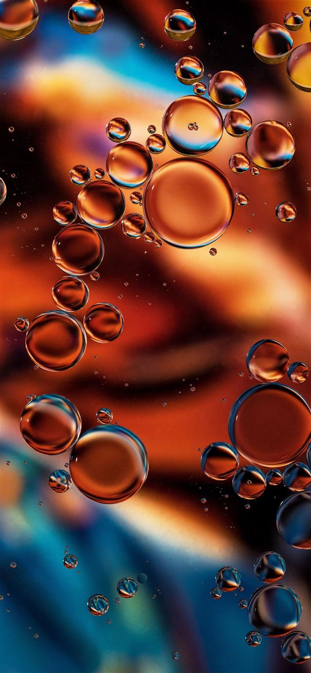  Copper Glow Oil drops on water The background is ... iPhone 12 wallpaper 