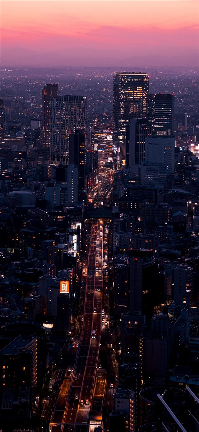 aerial view of city buildings during night time iPhone 12 wallpaper 