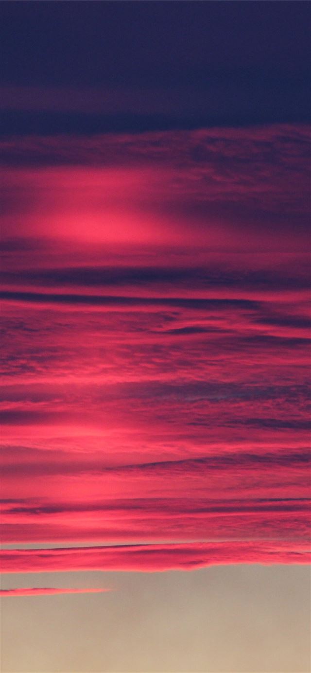 red pink burning clouds 4k iPhone 12 wallpaper 
