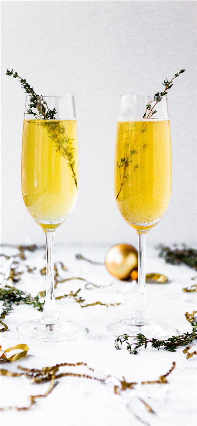 shallow focus photography of champagne glasses sur... iPhone 12 wallpaper 