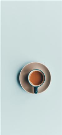 blue ceramic coffee cup and white saucer wallpaper