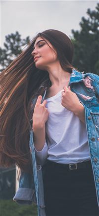 woman holding her white shirt flipping hair wallpaper