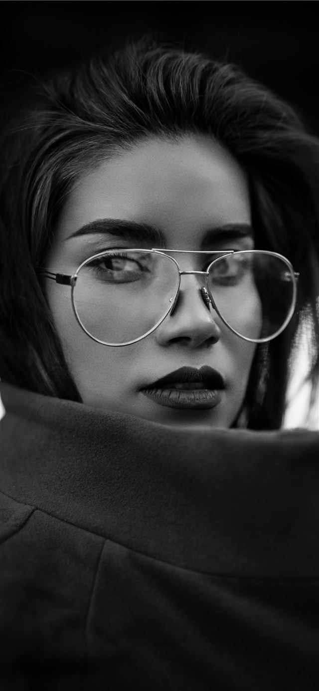 grayscale photo of woman wearing coat and eyeglass... iPhone 12 wallpaper 