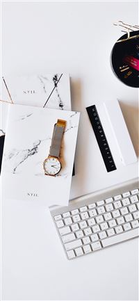 Apple Magic Keyboard near round gold colored analo... wallpaper