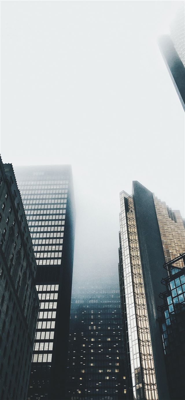 1170x2532 high rise buildings covered with fog - blue iPhone 12 Wallpaper