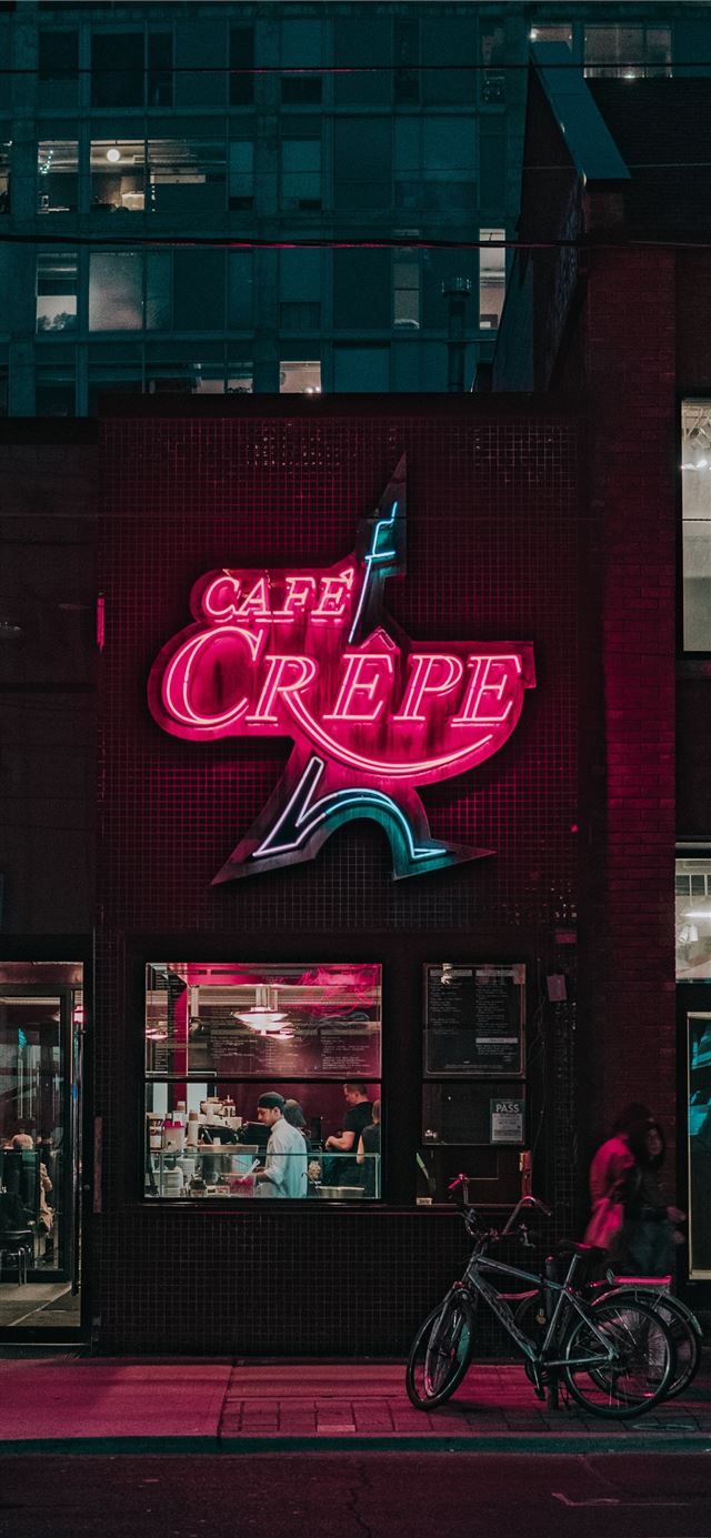 two people standing in front of Cafe Crepe storefr... iPhone 12 wallpaper 