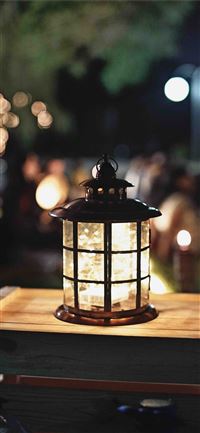 lamp on brown wooden box with shallow depth of fie... wallpaper