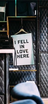 i fell in love here poster in a room wallpaper