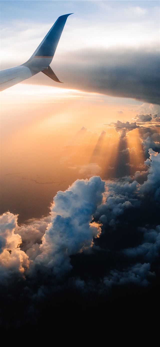 airplane on sky during golden hour iPhone 12 Wallpapers Free Download