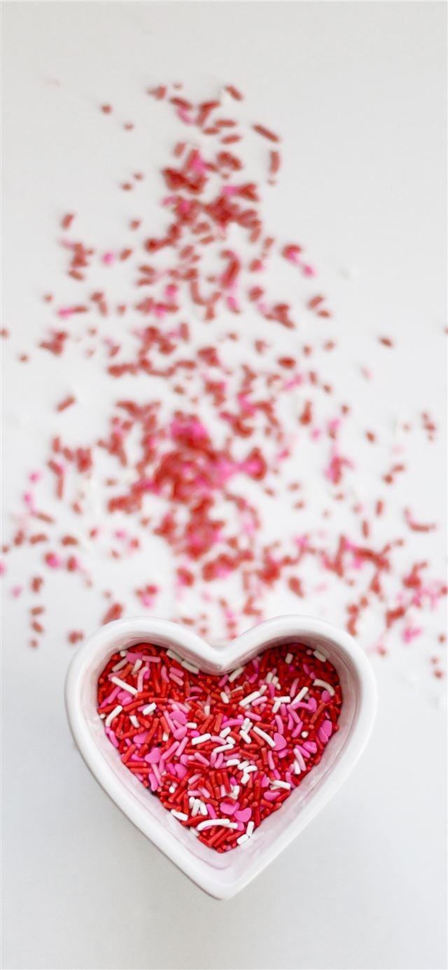 selective focus photo ofsprinkles in heart ceramic... iPhone 12 wallpaper 