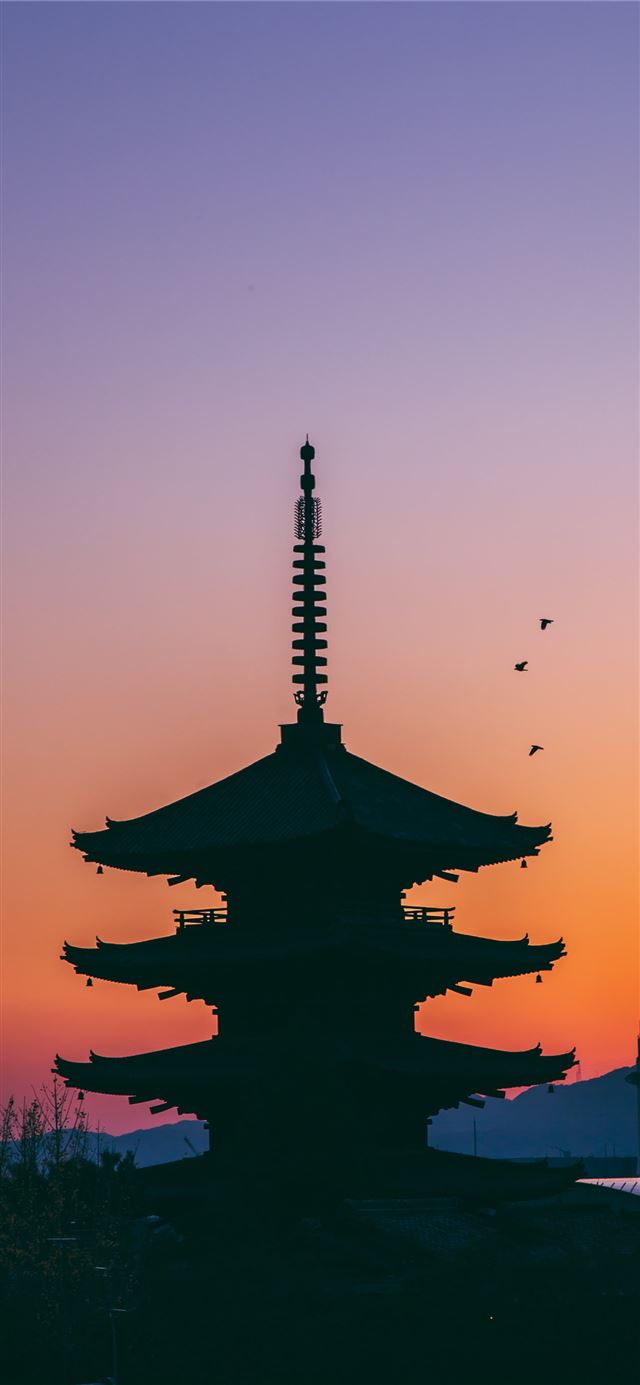 silhouette photo of pagoda iPhone 12 wallpaper 