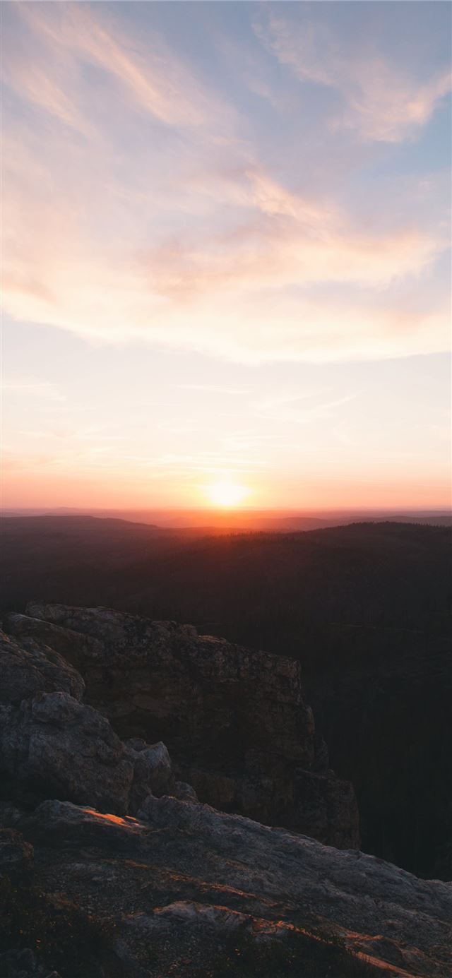 skyline photography of sunset above the horizon iPhone 12 wallpaper 