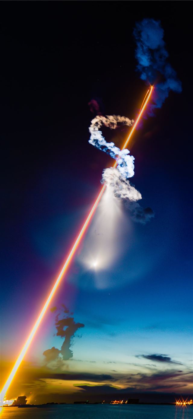rocket launched at nighttime iPhone 12 wallpaper 