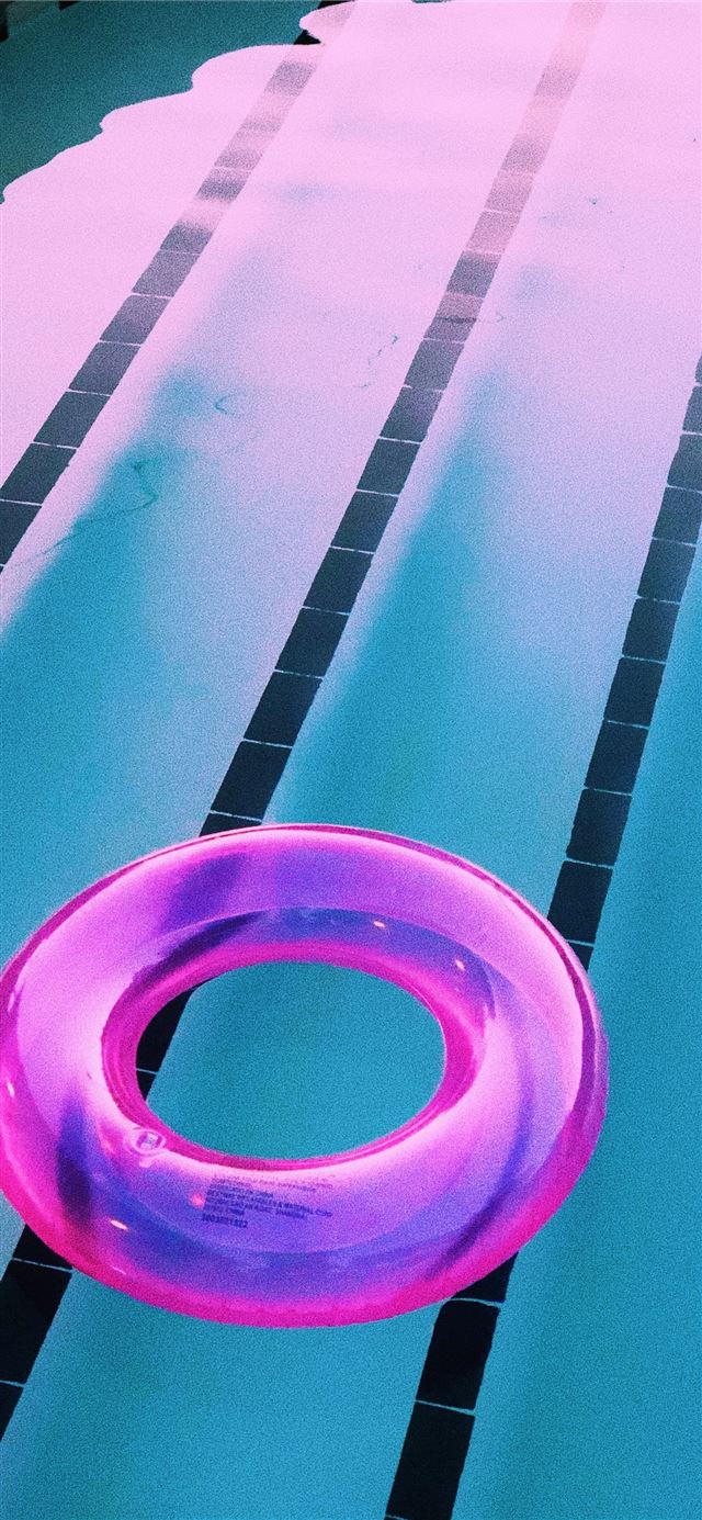 pink inflatable ring on pool iPhone 12 wallpaper 
