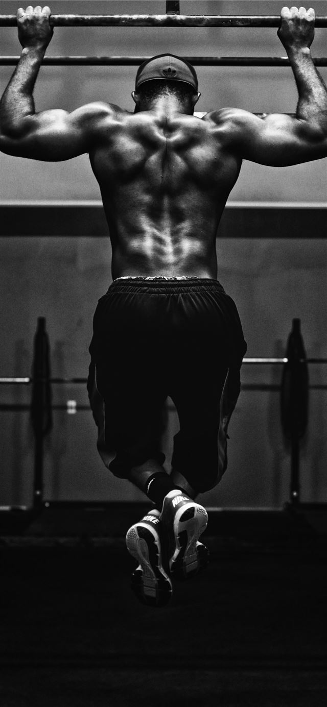 grayscale photo of man working out iPhone 12 wallpaper 