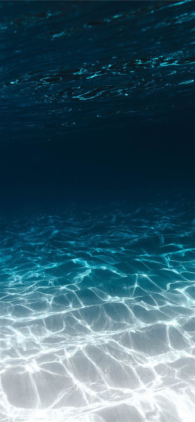 1284x2778 grey sand under blue clear water - nature iPhone 12 Wallpaper