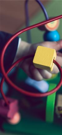 selective focus photo of baby playing activity cub... wallpaper