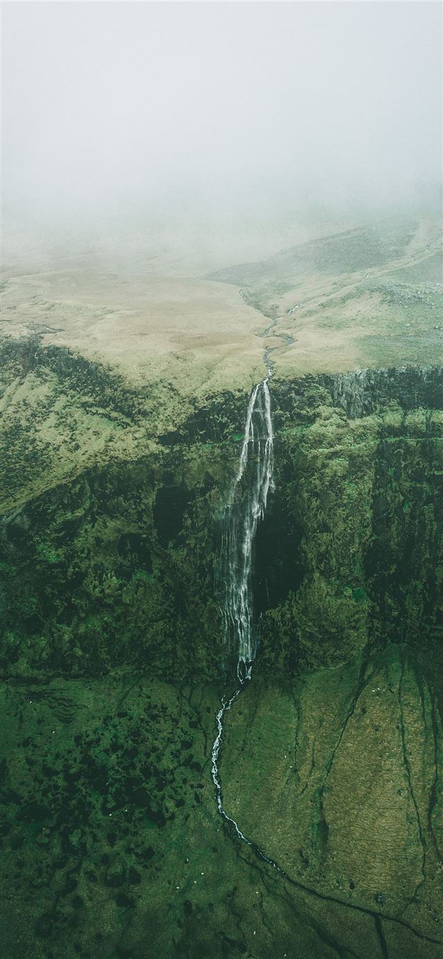 aerial photo of waterfalls during foggy weather iPhone 12 wallpaper 