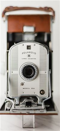 silver and brown Polaroid land camera wallpaper
