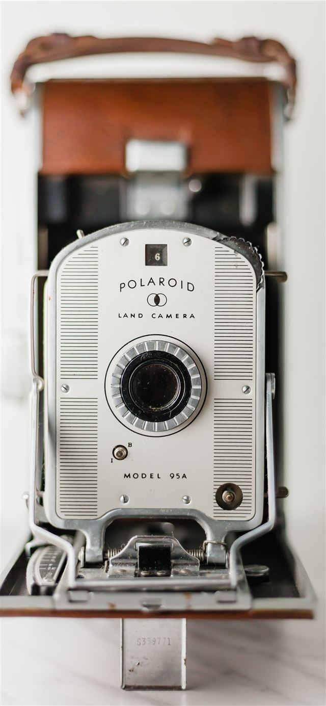 silver and brown Polaroid land camera iPhone 12 wallpaper 
