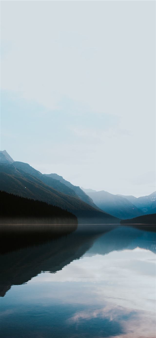 mountains surrounded by body of water iPhone 12 wallpaper 