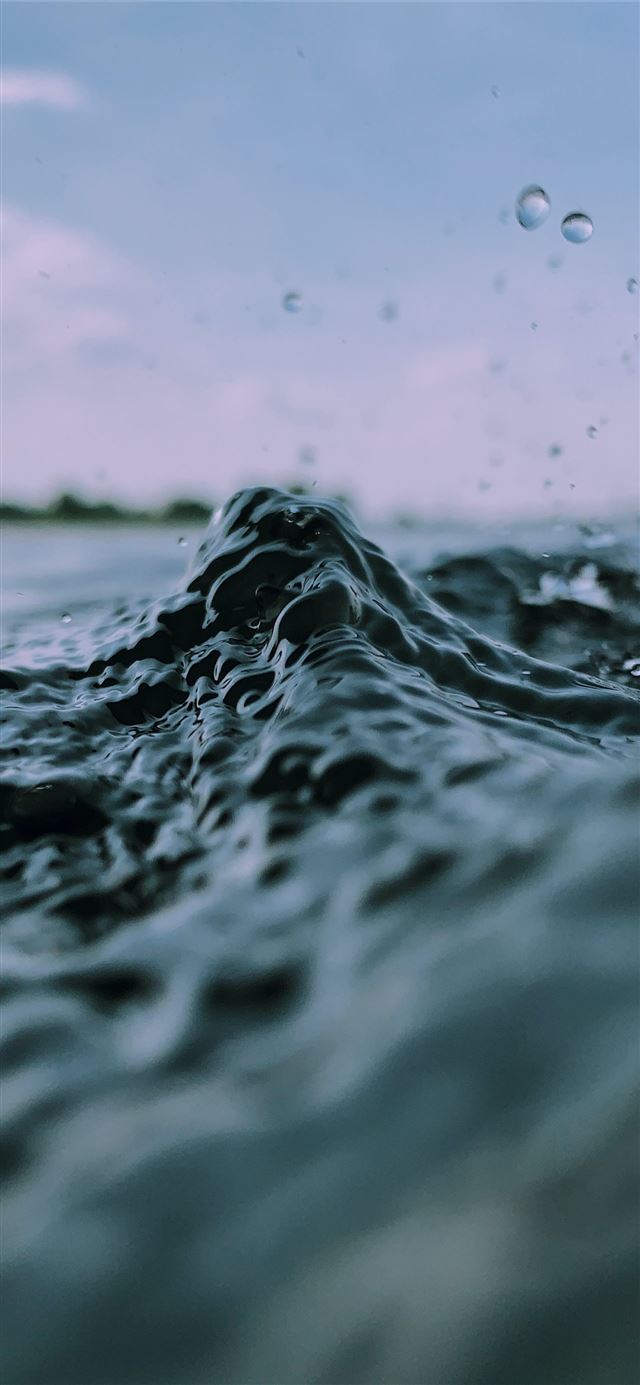 water splash in sea surface iPhone 12 wallpaper 