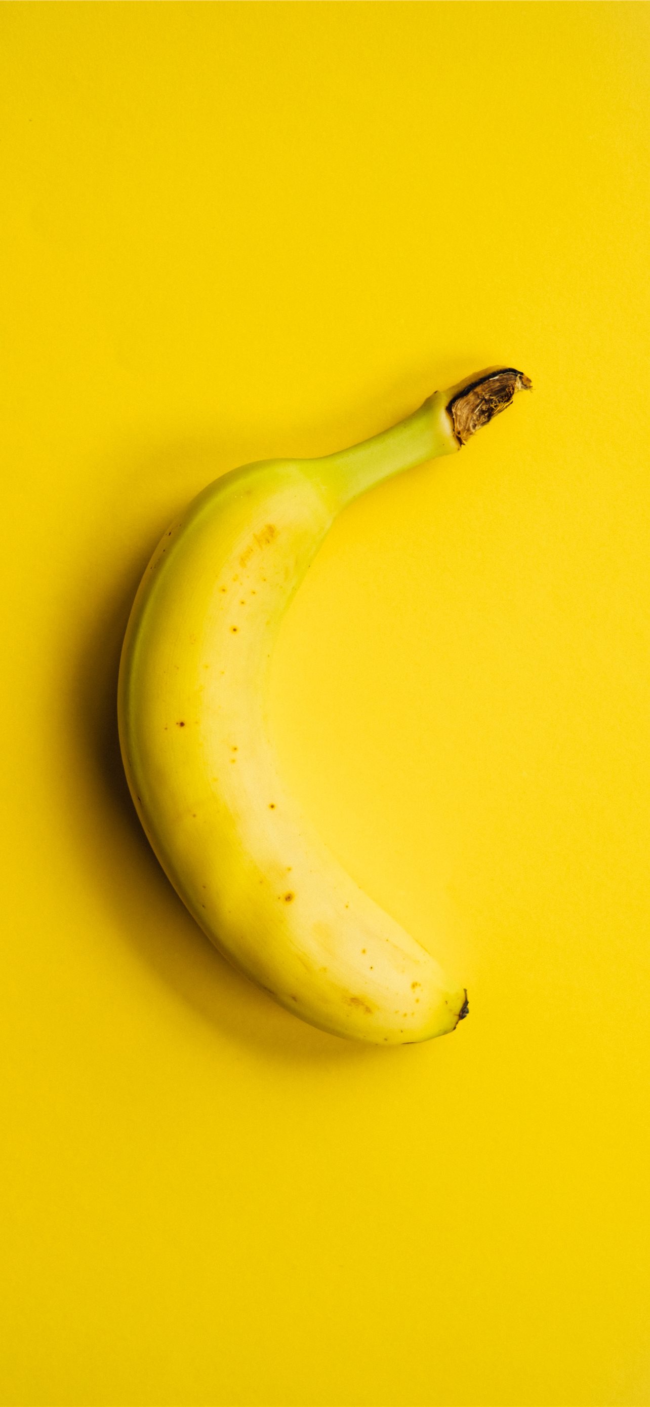 yellow banana fruit on yellow surface iPhone Wallpapers Free Download