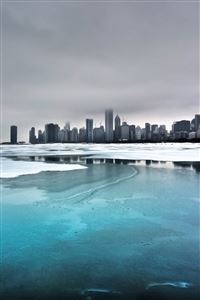 Frozen lake and city wallpaper