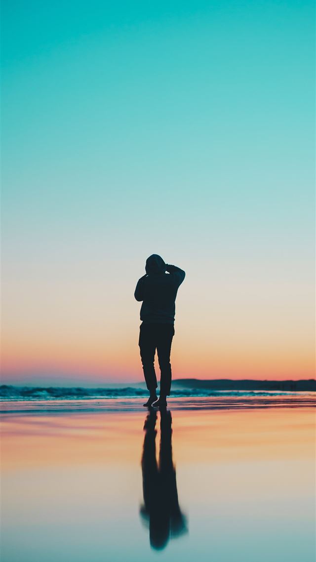 1080x1920 silhouette of person in seashore during daytime - australia iPhone 8 Wallpaper