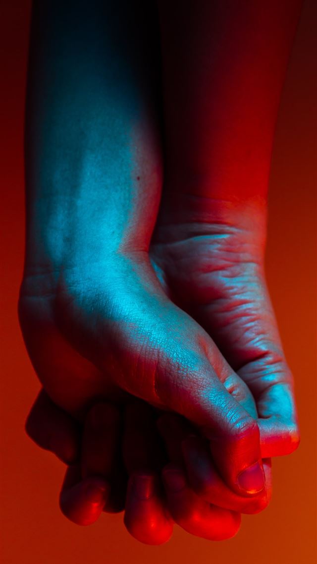 1080x1920 two person holding hands near orange background - red iPhone 8 Wallpaper