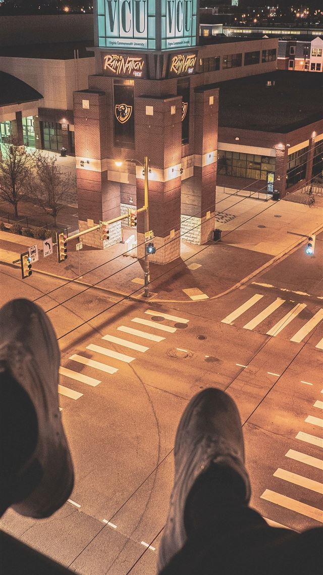 1080x1920 person sitting on top of building overlooking ligh... - road iPhone 8 Wallpaper