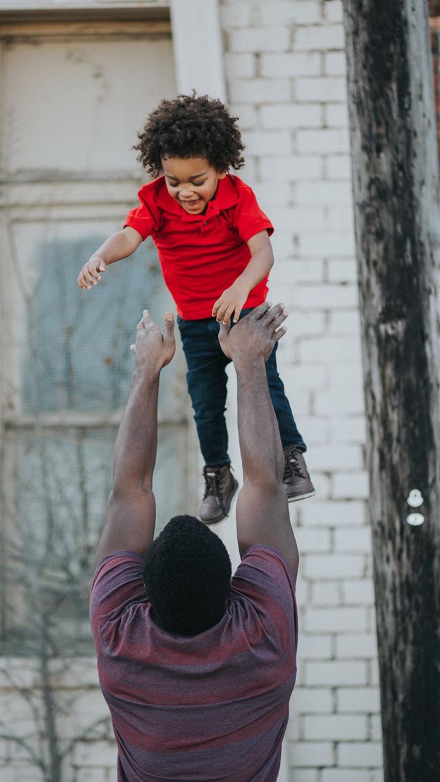 1080x1920 man wearing purple and red shirt catching child we... - black iPhone 8 Wallpaper