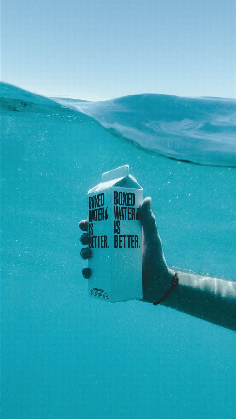 person holding boxed water underwater iPhone 8 wallpaper 