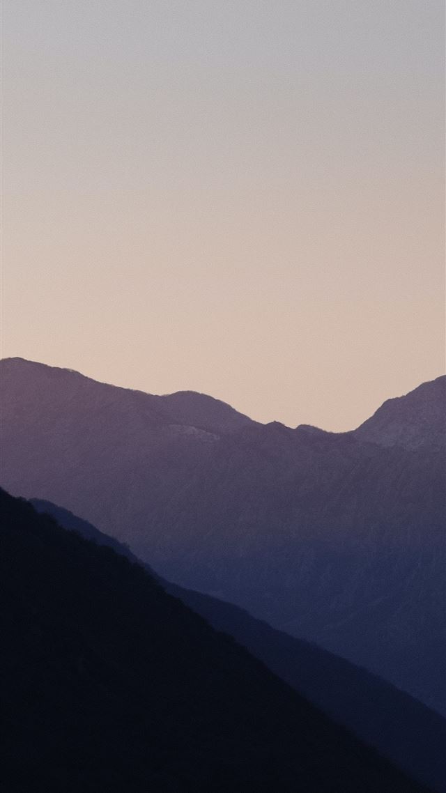 1080x1920 silhouette of mountains during daytime - mountain iPhone 8 Wallpaper