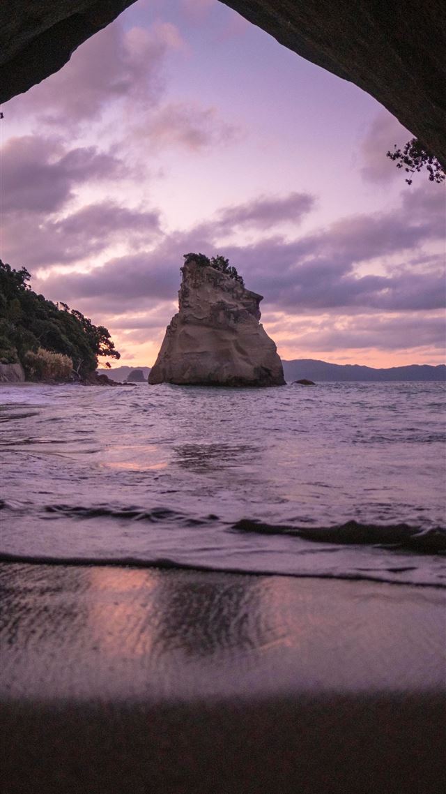 1080x1920 brown cave in front of shoreline - water iPhone 8 Wallpaper