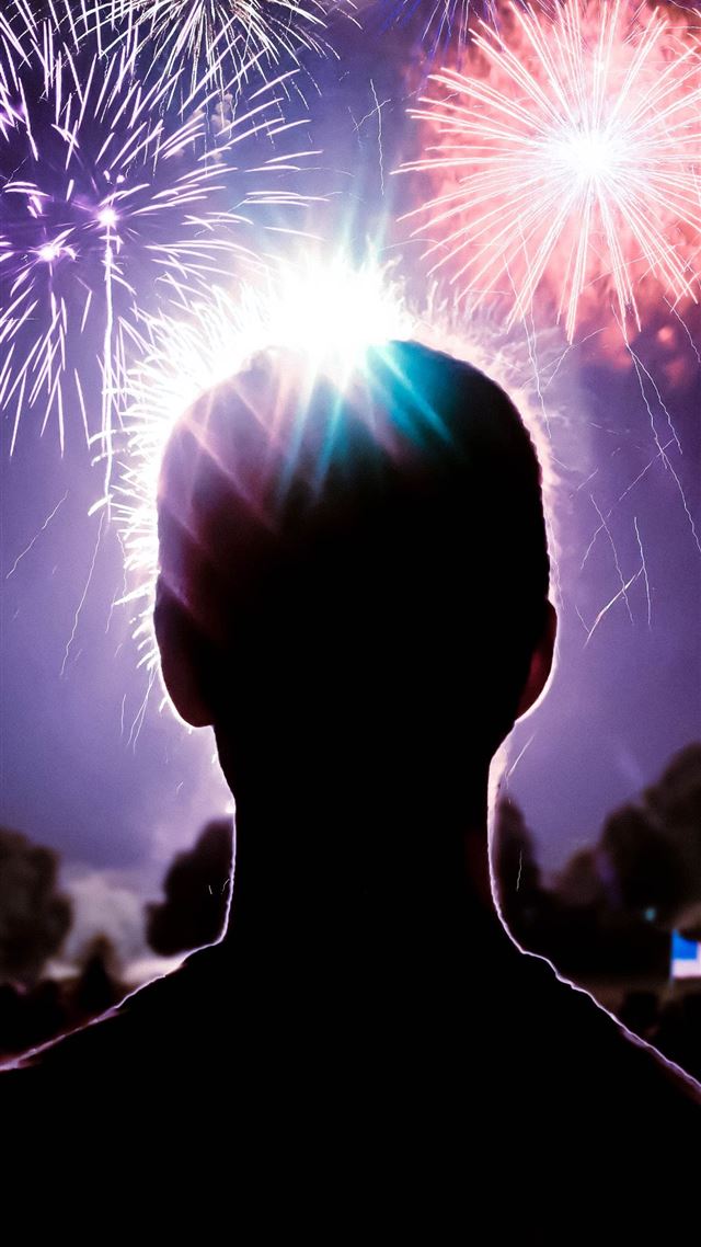 1080x1920 person looking at fireworks display - night iPhone 8 Wallpaper