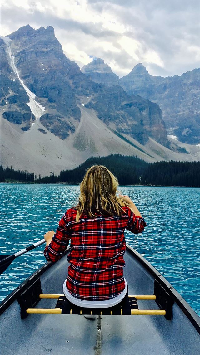 1080x1920 brown haired woman riding boat during day time - boat iPhone 8 Wallpaper
