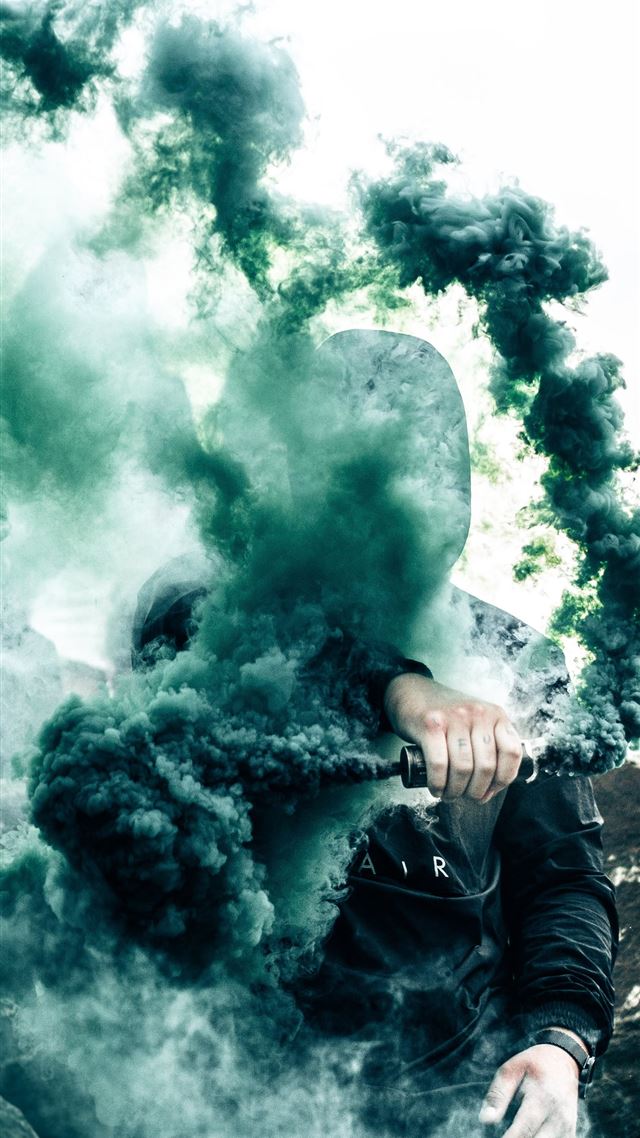 1080x1920 person holding gas grenade - toronto iPhone 8 Wallpaper