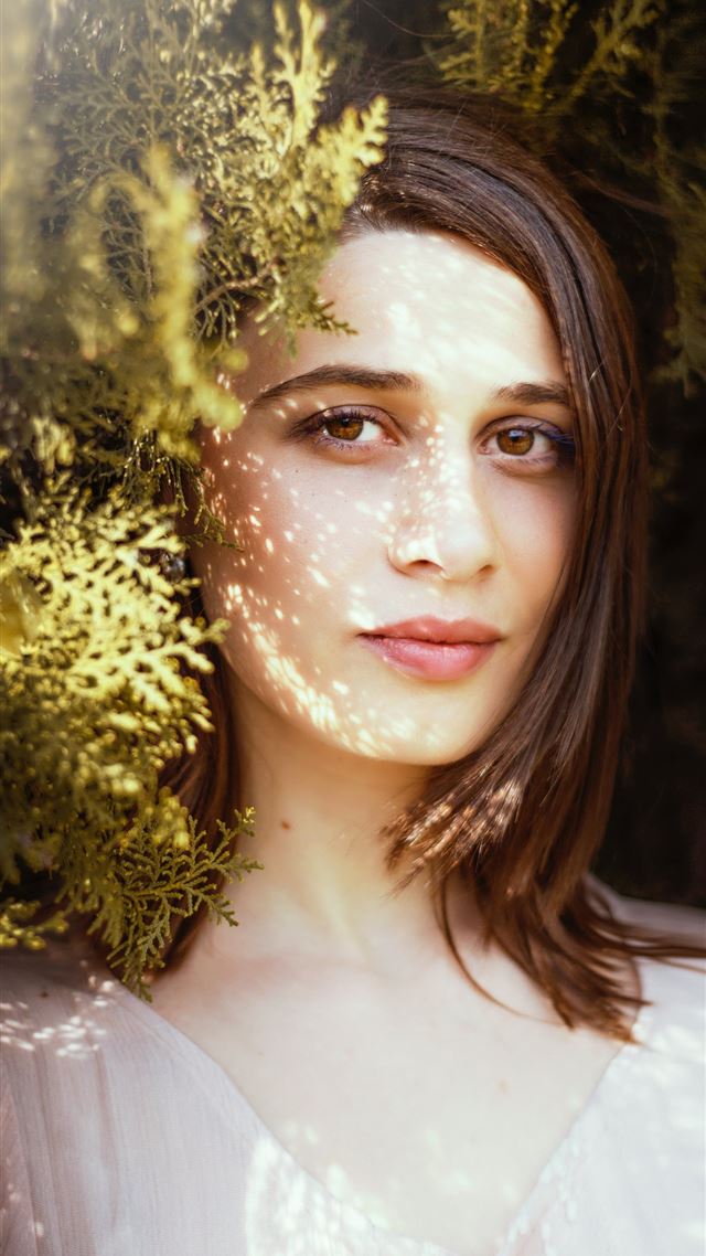 1080x1920 woman near green leafed plants during daytime - spring iPhone 8 Wallpaper