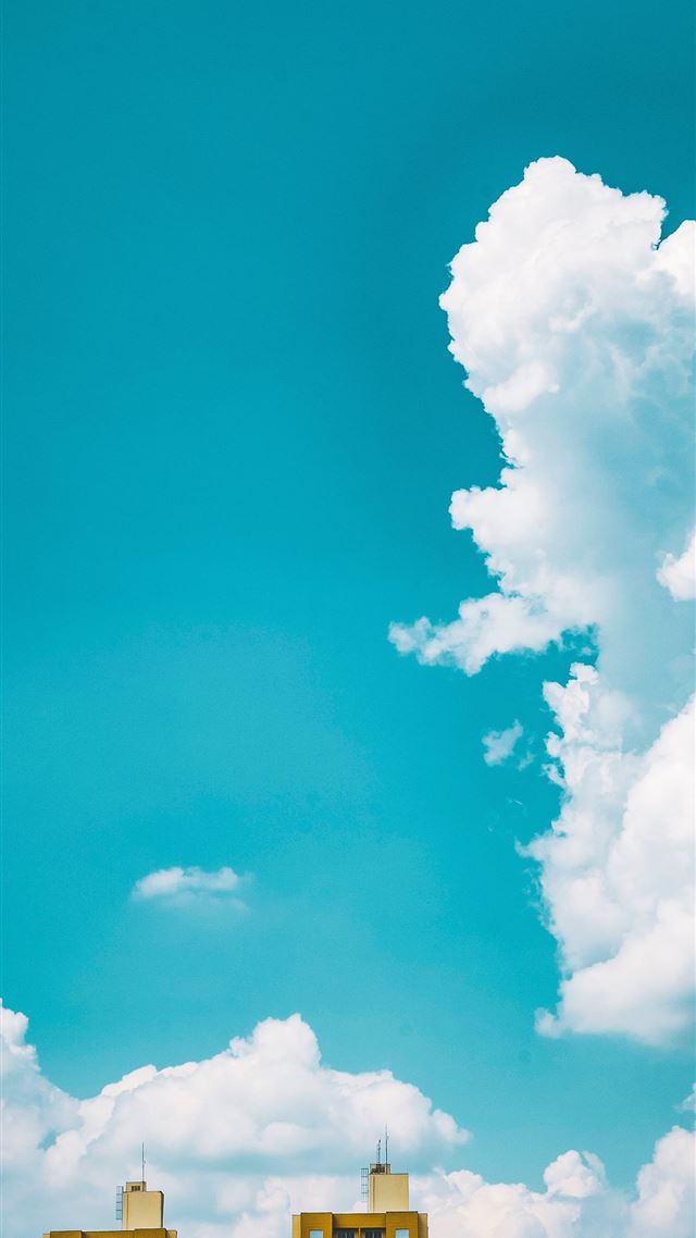 1080x1920 two brown tall buildings under white sky during da... - sky iPhone 8 Wallpaper