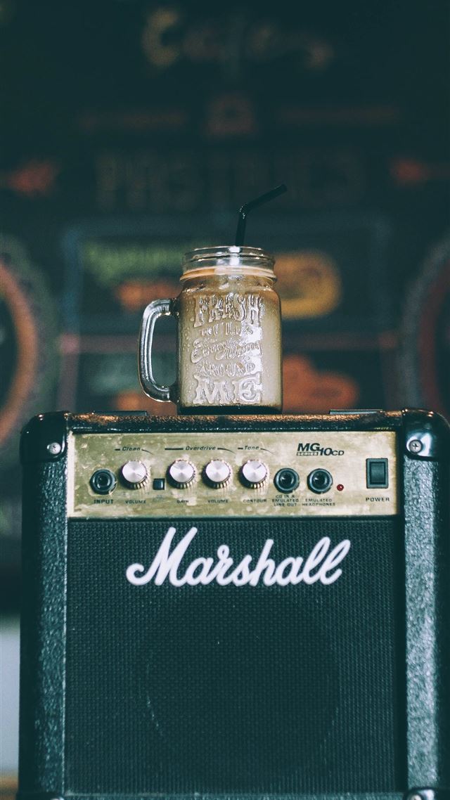 1080x1920 black Marshall guitar amplifier with glass mug on ... - retro iPhone 8 Wallpaper