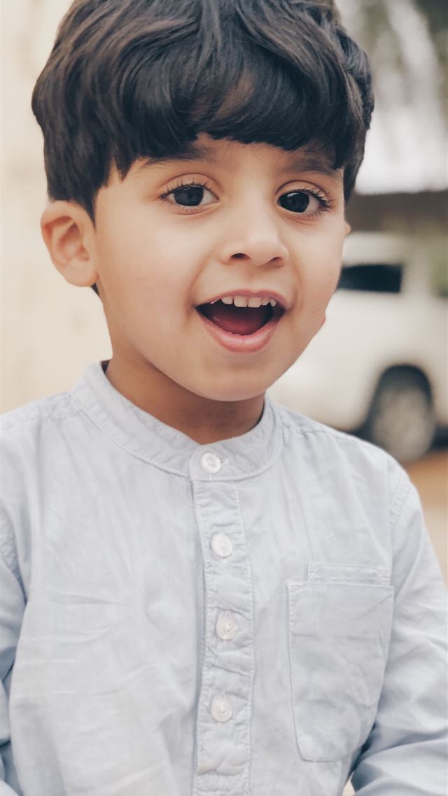 1284x2778 boy in white dress shirt smiling -  iPhone 8 Wallpaper