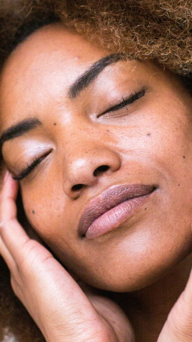 1284x2778 woman lying on brown textile -  iPhone 8 Wallpaper